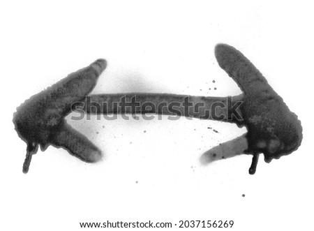 Black spray stain in shape arrow isolated on white background, photo with clipping path