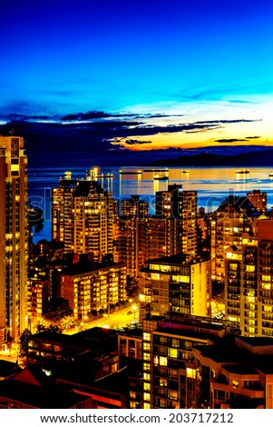 Vancouver downtown skyline and bay at golden sunset. Aerial view with copy space. 
