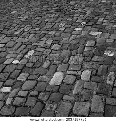 Cobblestone pavement. Stone vintage paved backdrop black and white