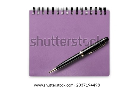 Office pen, blank notebook on the desk