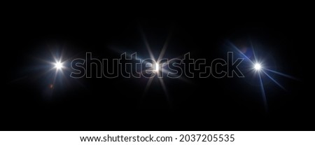 Easy to add lens flare effects for overlay designs or screen blending mode to make high-quality images. Set of abstract sun burst, digital flare, iridescent glare over black background. Royalty-Free Stock Photo #2037205535