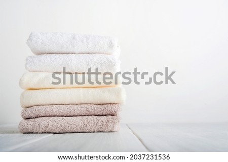 Stack of clean bath towels and copy space.