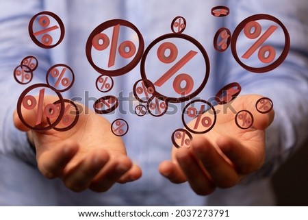 A person presenting 3D render of sales and percentage icons