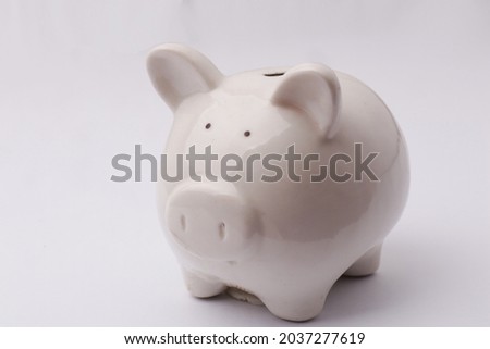 Close-up of piggy bank piggybank over white background, investment concept