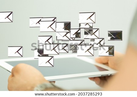 A person presenting the virtual projection of email marketing concept with digital envelopes