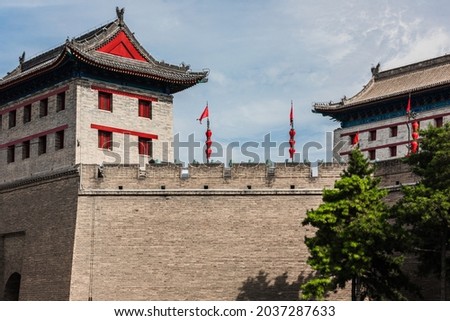 The 600 year old Ming Dynasty city wall in Xi'an, Shaanxi, China, the Ming city wall of Xi'an and the landscape of the park around the city in summer