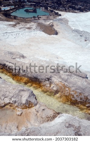 Pamukkale travertine texture. Wavy limestone textured deposits on terraces of carbonate minerals in Pamukkale, Turkey.