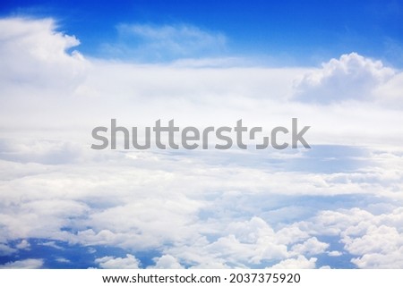 White clouds on blue sky background view from above, airplane flight landscape, beautiful aerial cloudscape, skies backdrop, fluffy cloud texture, sunny heaven, cloudy weather, cloudiness, copy space
