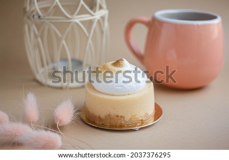 lemon cake with cream, coffee cup