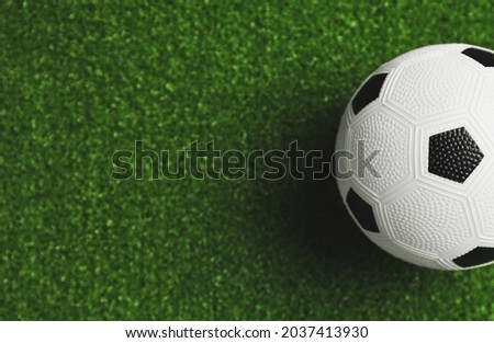 Soccer ball on green field