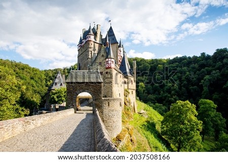 Eltz Castle, a medieval castle located in Germany, Rheinland Pfalz, Mosel region. Beautiful old castle, famous tourist attraction on sunny summer day, empty, without people, nobody. Royalty-Free Stock Photo #2037508166