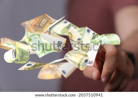 The bill euro banknote in hand rain