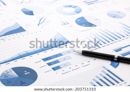 pen on blue charts, graphs, data and reports background for education and business concepts Royalty-Free Stock Photo #203751310