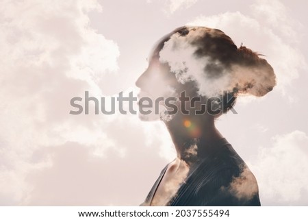 Psychology and woman mental health and weather dependent concept. Multiple exposure clouds and sun on female head silhouette. Royalty-Free Stock Photo #2037555494