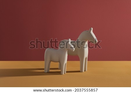 Colorfuhl decorative wooden horse with sadow on background
