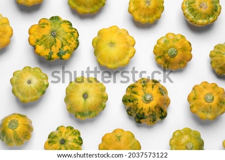 Fresh ripe pattypan squashes on white background, top view