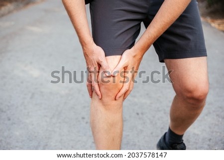 A man having knee patellofemoral pain syndrome Royalty-Free Stock Photo #2037578147