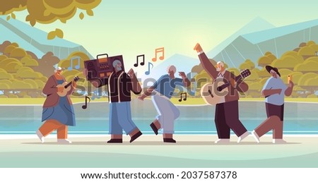 mix race senior people with bass clipping blaster recorder dancing and singing grandparents having fun active old age