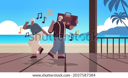 senior family with bass clipping blaster recorder dancing and singing africna american grandparents having fun