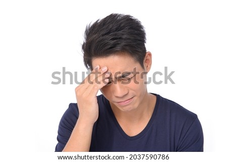 portrait of handsome young man model with stressed face posing in studio