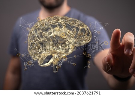 A closeup of a 3d rendered brain and a man touching