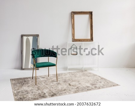 Luxurious living room interior with chair, shelves and mirror with mockup poster. Paste your photo here Royalty-Free Stock Photo #2037632672