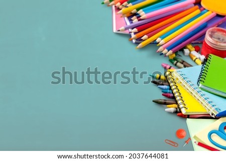 Back to school concept. Colorful stationary school supplies on the desk