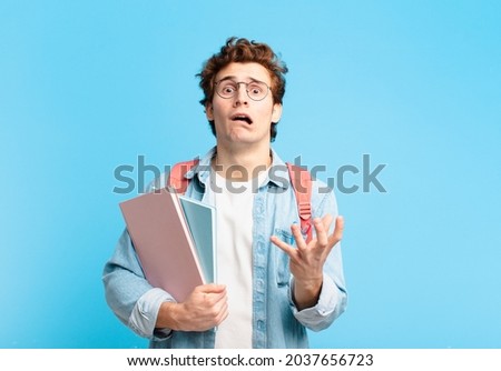 young student boy looking desperate and frustrated, stressed, unhappy and annoyed, shouting and screaming Royalty-Free Stock Photo #2037656723