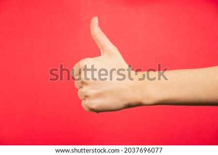 Hand making signs, sign language, red background