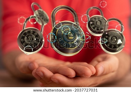 A person holding an illustration of padlocks - the concept of cybersecurity and network protection