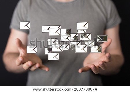 A network communications concept with floating letter signs in hands