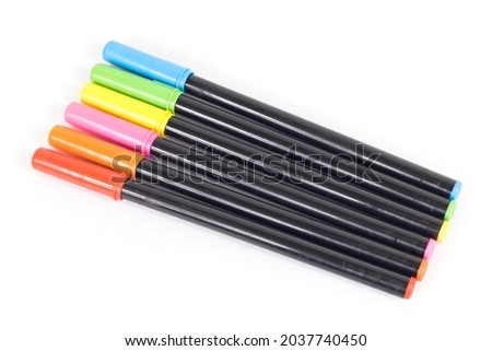 Magic multicolored pens isolated on white background