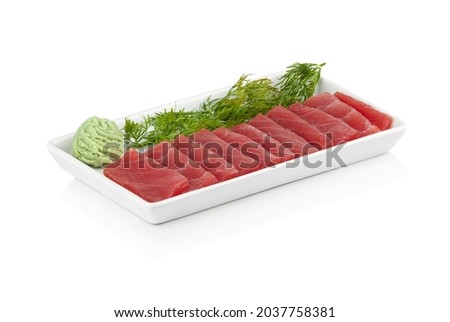 Tuna tataki plate on white background. Slices of fresh tuna. Asian food