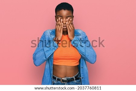 Young african american woman wearing casual clothes rubbing eyes for fatigue and headache, sleepy and tired expression. vision problem 