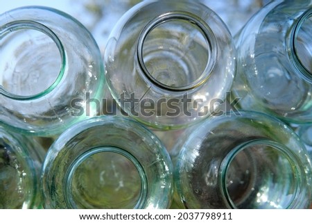 Large glass jars, side view, abstraction