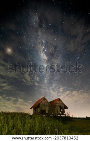 A coulple house under the Milky way