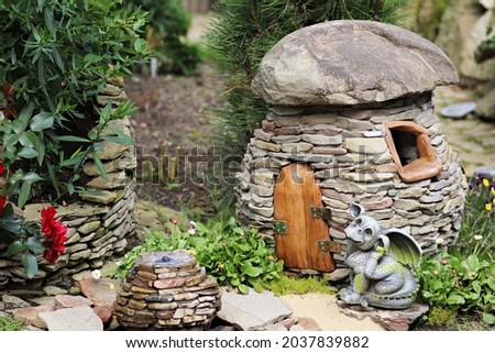 Mushroom, stone house, garden decoration. Original and unique garden ornament. Tylicz Poland Royalty-Free Stock Photo #2037839882