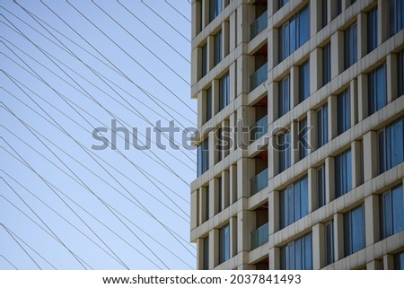 lines and square windows of a high-rise building . High quality photo