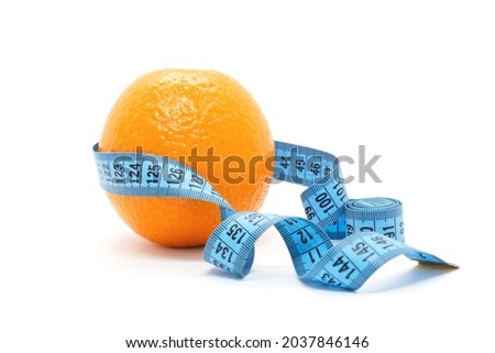 Fruit orange is wrapped with blue measuring tape on white background. Orange peel as a symbol of cellulite on the skin. Slimming, body shaping, skin care. Anti-cellulite creative concept. Royalty-Free Stock Photo #2037846146