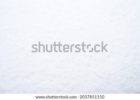 textured surface of pure clean white fresh snow in a cold snowy winter. bright natural countryside background. top view, space for text