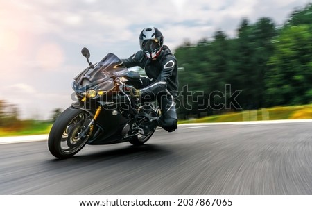 motorbike on the road driving fast. having fun on the empty highway on a motorcycle  journey. copyspace for your individual text. Royalty-Free Stock Photo #2037867065