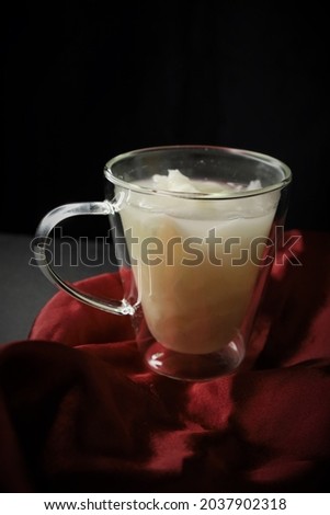 Coconut water in a glass which fresh white isolated photo