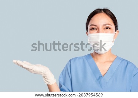 Female doctor with a presenting hand gesture