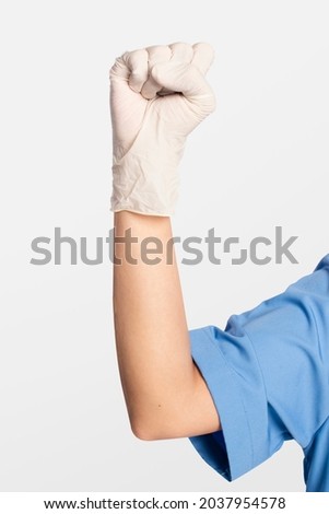 Medical gloves showing a fist