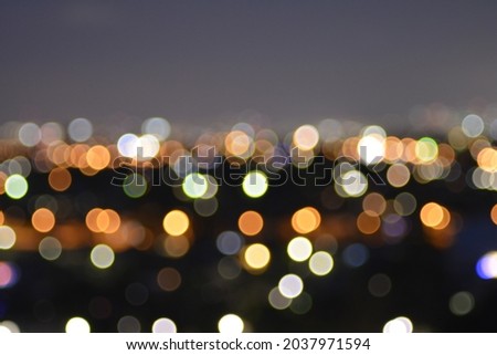 City lights shifted out of focus at dusk to create a blurred picture of the lights of Sydney, NSW, Australia