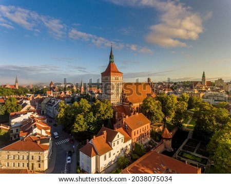 St. James, Evangelical church, castle of the Warmian chapter, garrison church of the Blessed Virgin Mary, Queen of Poland and the town hall - at sunrise - Olsztyn, Warmia and Masuria, Poland, Europe Royalty-Free Stock Photo #2038075034