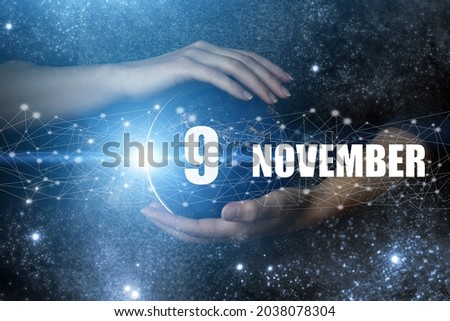 November 9th. Day 9 of month, Calendar date. Human holding in hands earth globe planet with calendar day. Elements of this image furnished by NASA. Autumn month, day of the year concept