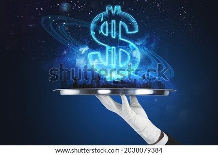 Close up of hand holding abstract tray with creative glowing polygonal dollar city hologram on blurry blue background. Cryptocurrency, online banking, price and trade concept