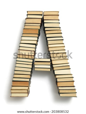 Letter A formed from the page ends of closed vintage hardcover books standing on a white background from a set or series of numbers