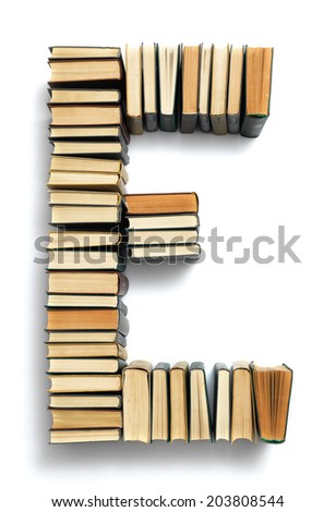 Letter E formed from the page ends of closed vintage hardcover books standing on a white background from a set or series of numbers